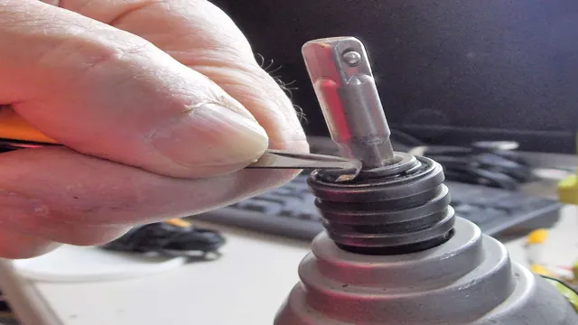 how to remove bit from ryobi impact driver